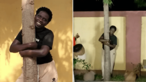 ugandan-activist-hugs-tree-for-16-hours-to-set-world-record-after-3-attempts