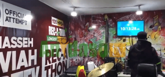 guinness-world-record:-heavy-downpour-wet-studios-of-beatmaker-attempting-record